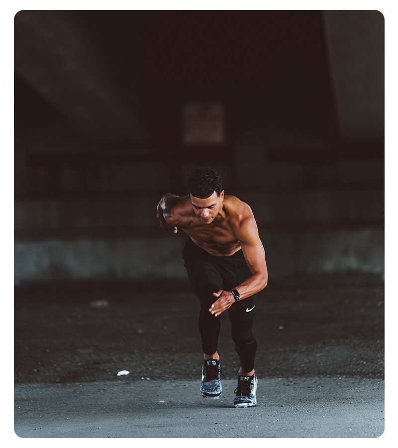 A fit young man running in the city